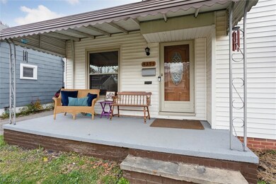 Doorway to property with covered porch
