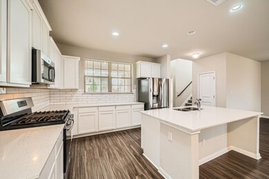 Kitchen with appliances with stainless steel fini