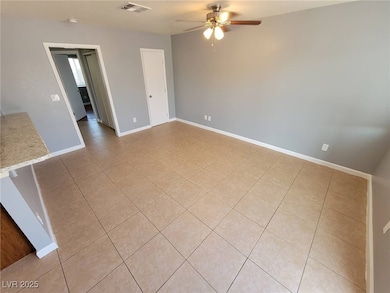 Unfurnished room featuring ceiling fan and light t