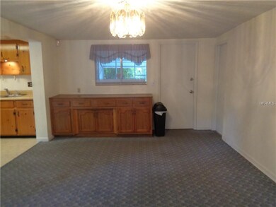 Family room or Dining room is adjacent to the Kitchen, with built in cabinetry.