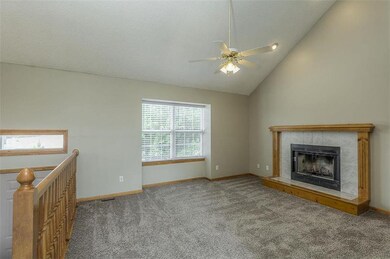 Lots of light in this living room with a fan and f