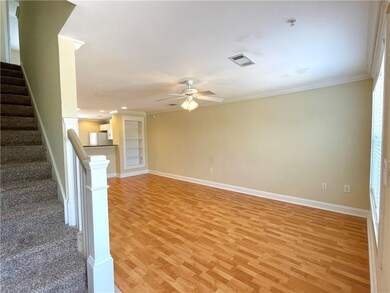 Unfurnished living room with crown molding, ceilin