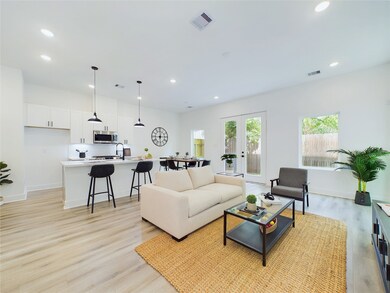 Open concept kitchen, dining, and living - ideal f