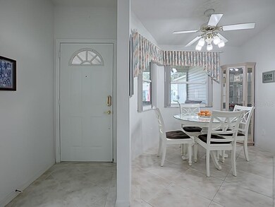 A VIEW OF THE FOYER AND DINING AREA