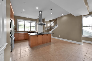 Kitchen leading to open concept dinning area.