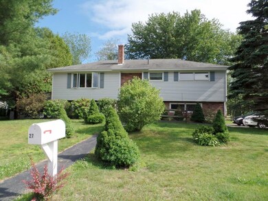 Mature plantings , double car garage...
