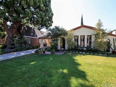 Large front yard fronts this Spanish charmer on a 