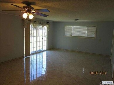 Family room has new sliding glass doors that lead 
