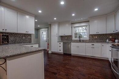 The elegant kitchen will take your breath- the updated colors and stainless appliances really make this kitchen a cook's paradise! 