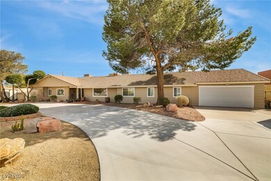 Single story home featuring concrete driveway, a t
