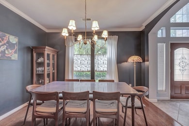 This dining room features elegant dark walls with