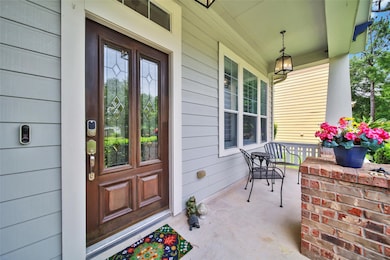 Adorable covered front porch – perfect for relaxin