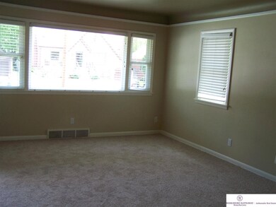 19 foot by 12 foot living room! Room for family and fun! With Fresh paint, Brand NEW windows and NEW carpet you have 3 good reasons to feel comfortable in this space!