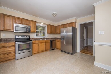 kitchen with tiled floors, stainless steel applian