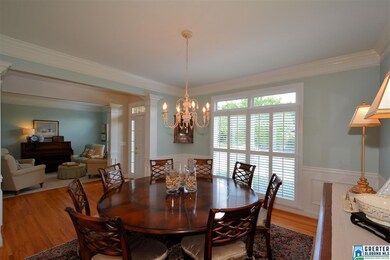 Features hardwood flooring, crown molding, chair r