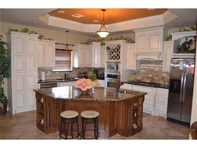 Kitchen. Custom cabinets, granite, island with sin