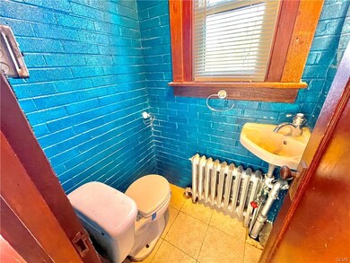 Funky retro half bath off the laundry room with a 