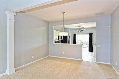 Spacious dining room opens to kitchen and living r