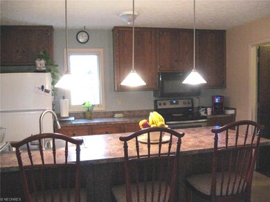 The main house's kitchen is open to the family roo