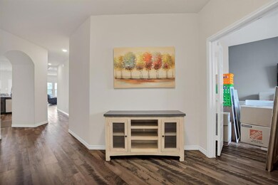 To the left the seller is boxing to relocate.  Perfect work from  home space.  Note the architectural details in this home.