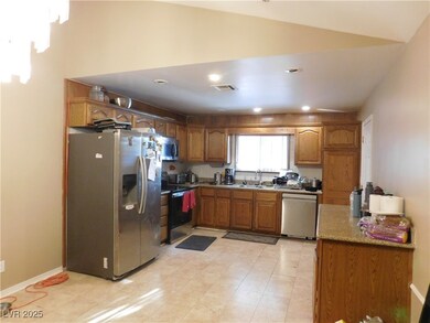 Kitchen featuring appliances with stainless steel