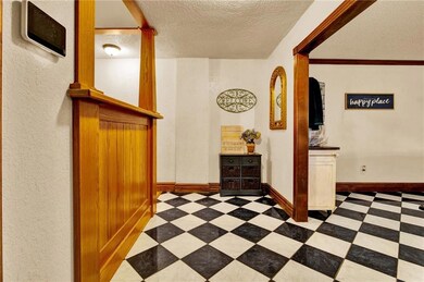 Entry leads to hall, living and upstairs