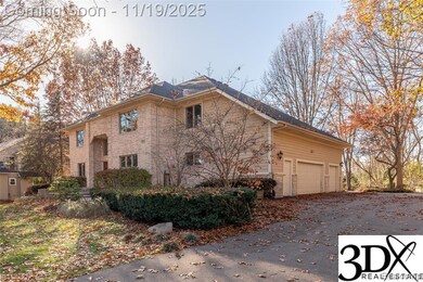 View of home's exterior featuring a garage and driveway