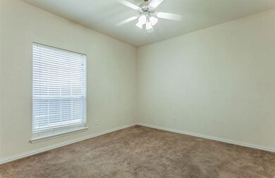 Spare room with baseboards, carpet flooring, and c