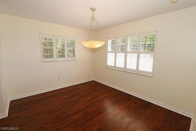 Unfurnished room featuring dark wood-type flooring