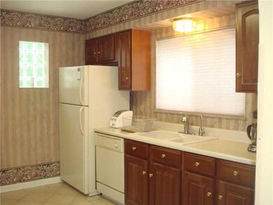 Kitchen. The refrigerator, built-in dishwasher and