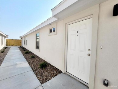 View of exterior entry featuring stucco siding
