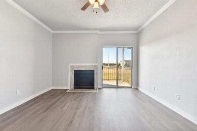 Unfurnished living room featuring ceiling fan, a 