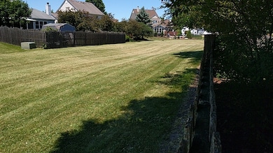 Open area outside rear fence