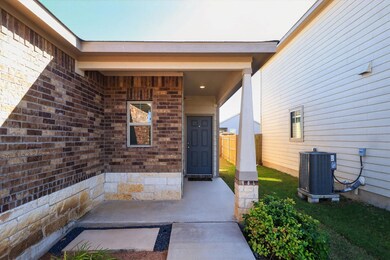 Entrance to property with brick siding