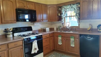 Updated kitchen with corian counter tops.