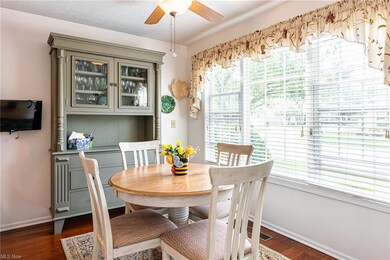 Spacious eating nook with a wall-mounted TV.