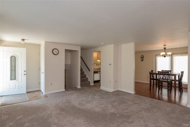 Entering into the foyer with ceramic tiles and a c