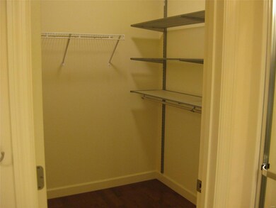 Primary bedroom walk in closet