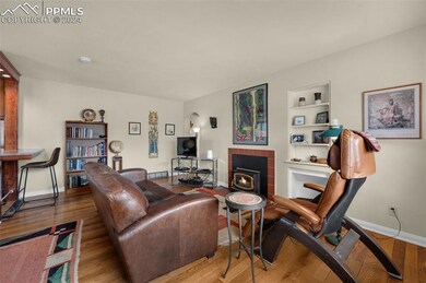 Wood floors greet you in the living room with buil