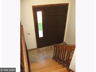 Foyer boasts new ceramic flooring, hardwood stairs
