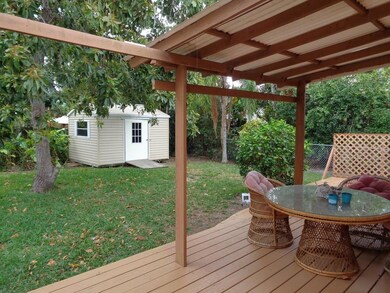 Yard with deck, shed & trees