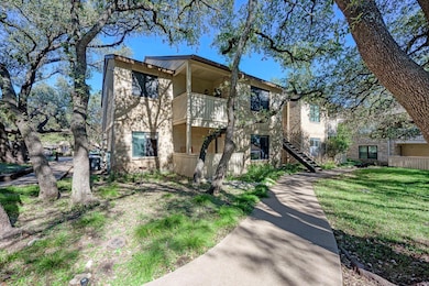 View of front facade featuring a balcony, stairs,