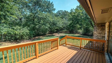 Wooden deck featuring a yard