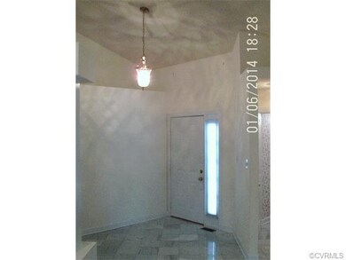 Marble Floored Foyer With Vaulted Ceiling