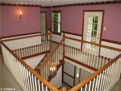 Foyer - Grand staircase wraps around foyer. Note t