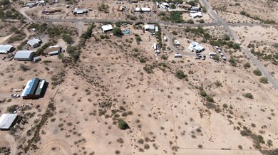 Lot to right of blue topped home