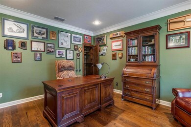 This luxurious office features hardwood floors, re
