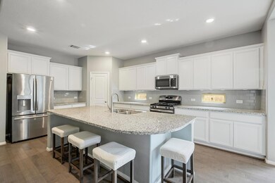 Kitchen featuring stainless steel appliances, a k