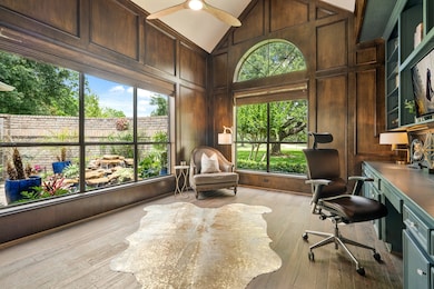 This spacious Study boasts a cathedral ceiling, ri