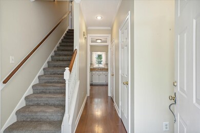 Entry featuring ornamental molding,  and wood-type